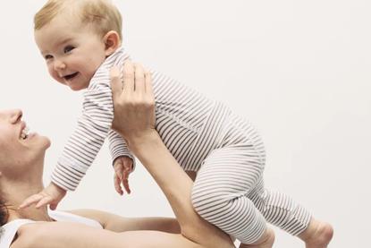 Mother holding happy baby